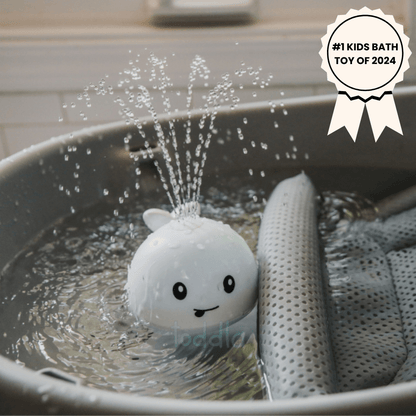 PequeNido™ Juguete de baño con ballena – Diversión salpicante para la hora del baño